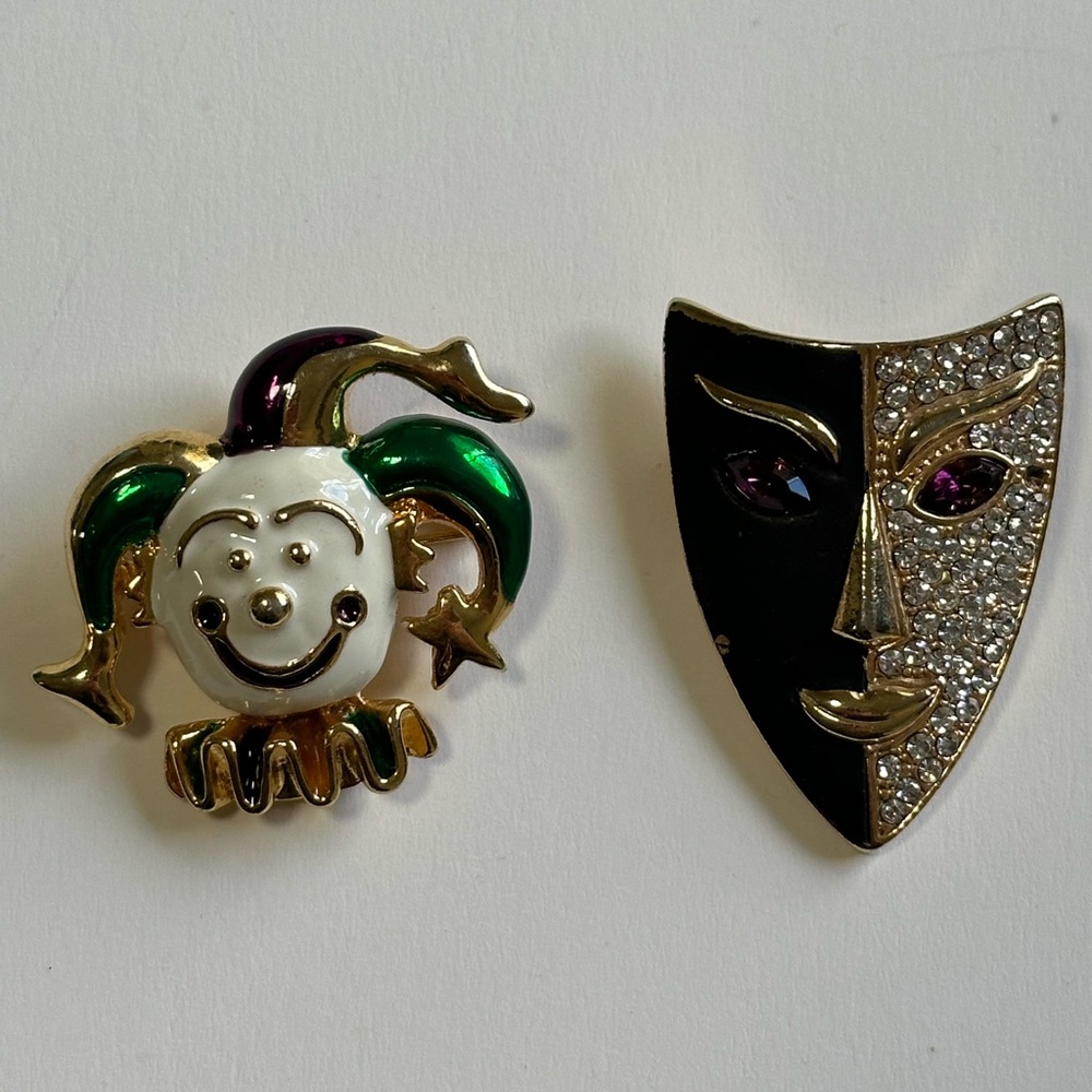 2 Mardi Gras brooches from the 1980s Enamel Clown and A Rhinestone Mask.